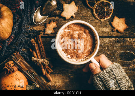 Autumn pumpkin spice latte on rustic wood background, top view Stock Photo