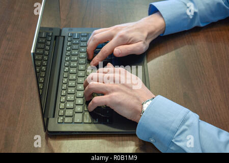 Typing on a computer two hands Stock Photo