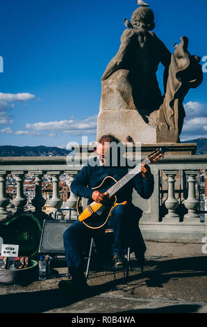 Musician playing classic guitar at midday in Placa d'Espanya in Barcelona, Spain, Europe Stock Photo