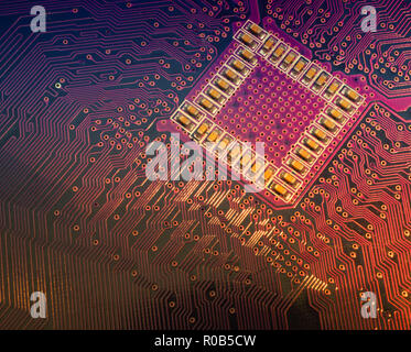 close up macro of back side of computer motherboard with lot of electric lanes connecting to main processor chip. good for black friday electronic sal Stock Photo