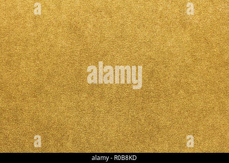 Christmas gold colored paper texture or vintage background Stock Photo