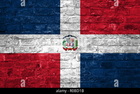 Flag of Dominican Republic over an old brick wall background, surface Stock Photo