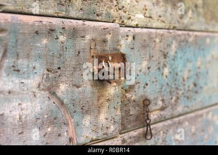 Old rusted lock on a wooden door (Pesaro, Italy, Europe) Stock Photo