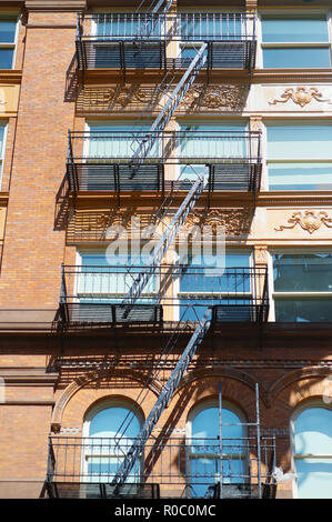 Close-up view of New York City apartment buildings with emergency stairs in Little Italy neighborhood of Manhattan NYC, USA Stock Photo