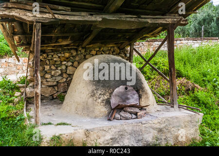 Traditional turkish wood fired stone brick oven and pita or pide bread  dough. This stone oven for Turkish pide or pita bread. Also known as Tandır  or Tandir Stock Photo