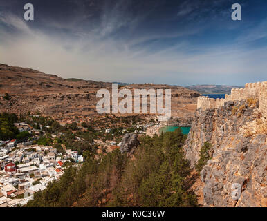 Village of Lindos with fortress on hilltop. Rhodes, Greece. Stock Photo