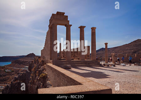 RHODES, GREECE - Oct 4, 2018: Tourists by the famous temple complex in Lindos village. Stock Photo