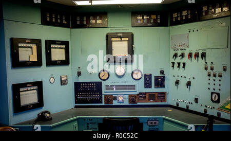 Old antique nuclear reactor desk with control gages and switches Stock Photo