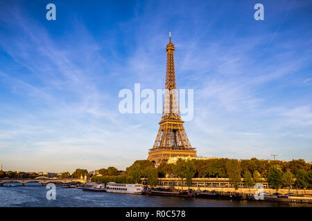 Paris, France - September 29, 2018: Eiffel Tower with sunlight before sunset with blue sky which viewing across Seine river.