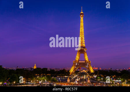 Paris, France - September 29, 2018: Eiffel Tower in yellow bright light with twilight sky from Trocadero view point.