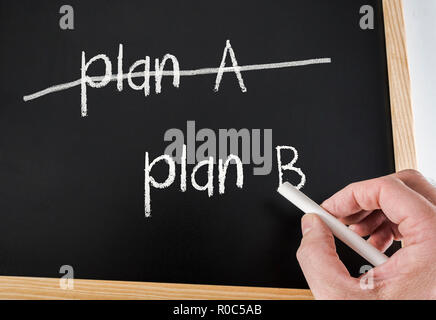 Crossing out Plan A and writing Plan B, conceptual image Stock Photo