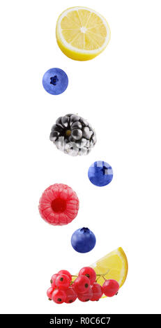 Flying fresh berries and lemon isolated on white background Stock Photo