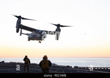 181031-N-WH681-0092 ATLANTIC OCEAN (Oct. 31, 2018) An MV-22 Osprey takes off from the flight deck of the Wasp-class amphibious assault ship USS Kearsarge (LHD 3) as part of an amphibious assault exercise during the Carrier Strike Group (CSG) 4 composite training unit exercise (COMPTUEX). COMPTUEX is the final pre-deployment exercise that certifies the combined Kearsarge Amphibious Ready Group's and 22nd Marine Expeditionary Unit's abilities to conduct military operations at sea and project power ashore through joint planning and execution of challenging and realistic training scenarios. CSG 4  Stock Photo