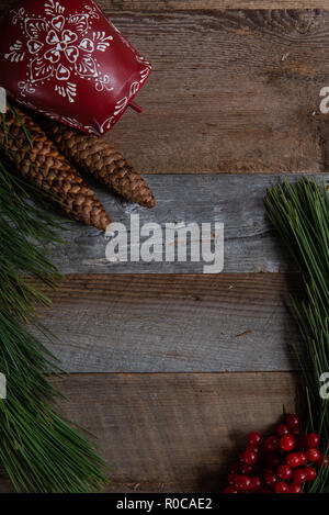 Authentic and rustic Christmas holiday decorations on weathered wood Stock Photo