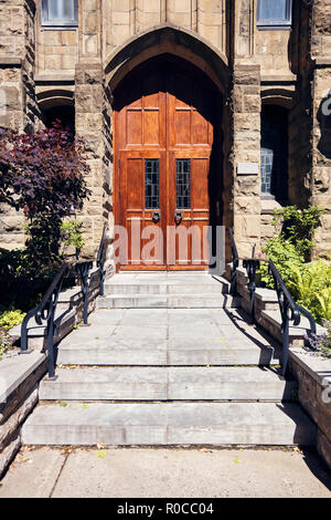 Maple antique wooden entrance door of an historical house in Montreal, Canada Stock Photo
