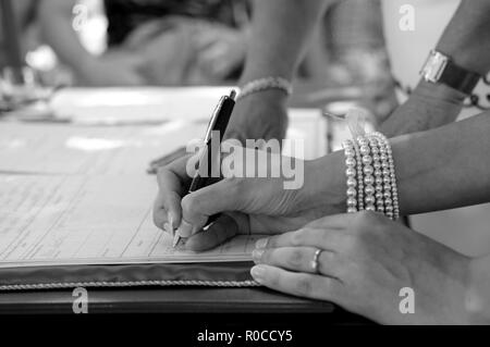 Signing a wedding document Stock Photo