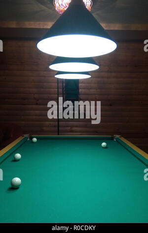 A billiard table has several layers and a cue 2018 Stock Photo