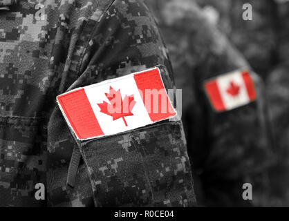 Canada flags on soldiers arm. Canadian troops Stock Photo