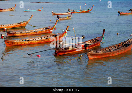 Thai fishing boats at sunset in Phuket Stock Photo