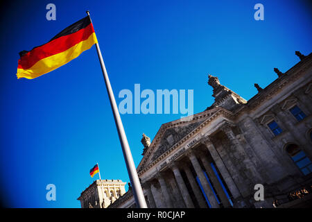 Berlin, Germany - German national flag outside the Reichstag building  home to the German parliament Stock Photo