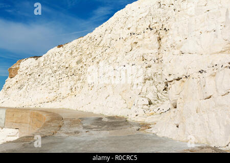 View to the east from the splash point, East Sussex. England, cliffs, blue sky, near Seven Sisters National park, selective focus Stock Photo