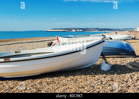 Fishing boats in Seaford beach, East Sussex. England, pebbly beach and blue sea, view of Newhaven town, selective focus Stock Photo