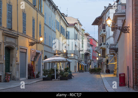 PARMA, ITALY - APRIL 18, 2018: The street of the old town at dusk. Stock Photo