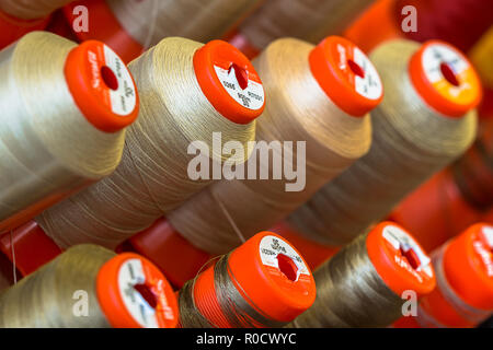 Industrial Sewing thread in a tailor workshop studio Stock Photo