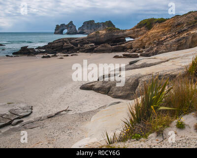 Rock formations on Wharariki Beach, North Island, New Zealand Stock Photo