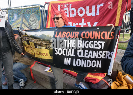 London, UK. 3rd November 2018. Class War supporters came to the 'No Demolitions Without Permission' housing protest at City Hall with banners declaring that Labour Councils were the biggest social cleansers in London and 'Labour, Labour Home Snatchers! Even Worse Than Maggie Thatcher', pointing out that it was largely Labour councils who were demolishing council estates so that developers could replace council houses with large numbers of properties sold at high market prices and a miserably small number of homes at social rent, promoting schemes which cut by thousands the number of council ho Stock Photo