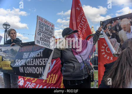 London, UK. 3rd November 2018. Class War supporters came to the 'No Demolitions Without Permission' housing protest at City Hall with banners declaring that Labour Councils were the biggest social cleansers in London and 'Labour, Labour Home Snatchers! Even Worse Than Maggie Thatcher', pointing out that it was largely Labour councils who were demolishing council estates so that developers could replace council houses with large numbers of properties sold at high market prices and a miserably small number of homes at social rent, promoting schemes which cut by thousands the number of council ho Stock Photo