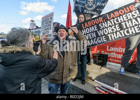 London, UK. 3rd November 2018. Class War supporters came to the 'No Demolitions Without Permission' housing protest at City Hall with banners declaring that Labour Councils were the biggest social cleansers in London and 'Labour, Labour Home Snatchers! Even Worse Than Maggie Thatcher', pointing out that it was largely Labour councils who were demolishing council estates so that developers could replace council houses with large numbers of properties sold at high market prices and a miserably small number of homes at social rent, promoting schemes which cut by thousands the number of council ho Stock Photo