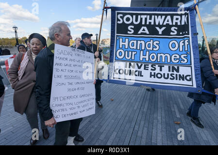 London, UK. 3rd November 2018. At the end of the rally people march around City Hall.Several hundred people, mainly from London's council estates under threat of demolition by Labour London councils came to a protest outside City Hall called by 'Axe the Housing Act'. The protest called for an end to estate demolitions unless  approved by a ballot of all residents, and for public land to be used to build more council homes rather than being turned over to developers to make huge profits from high-priced flats.  Credit: Peter Marshall/Alamy Live News Stock Photo