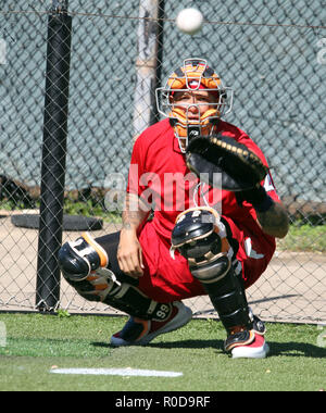 St. Louis Cardinals' Yadier Molina hits a single during the first ...