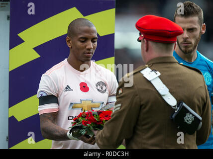 Bournemouth, UK. 3rd November, 2018. Ashley Young of Manchester United presents a wreath of poppies as part of the commemoration of Remambrance Sunday during the Premier League match between Bournemouth and Manchester United at the Goldsands Stadium, Bournemouth, England on 3 November 2018. Photo by Andy Rowland. . (Photograph May Only Be Used For Newspaper And/Or Magazine Editorial Purposes. www.football-dataco.com) Credit: Andrew Rowland/Alamy Live News