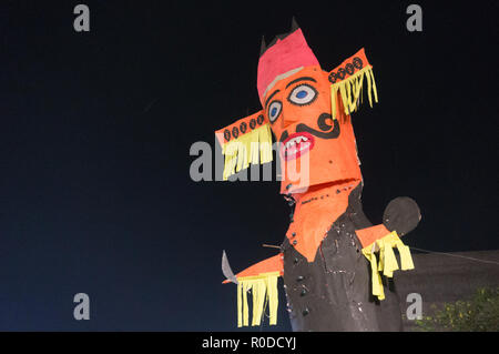 Ravan Ravana effigy standing against night sky on dussera Stock Photo