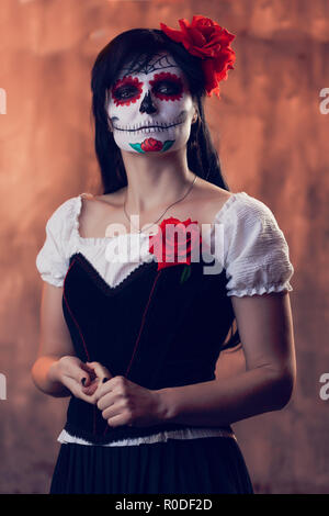 Halloween picture of woman with white make-up on her face, sewn on her mouth Stock Photo