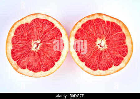 Two halves of juicy grapefruit. Stock Photo