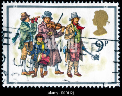 Postmarked stamp from the United Kingdom and Northern Ireland in the  Christmas 1978 - Carol Singers series Stock Photo