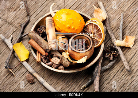 Spices and ingredients for winter and autumn drink mulled wine.Autumn still life. Stock Photo