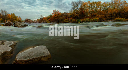 autumn yellow leaves panorama small river Southern Bug stones rocks Stock Photo