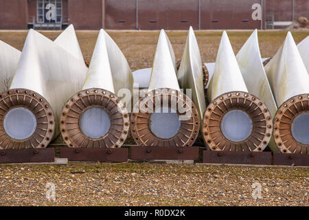 A row of spare wind turbine blades on wins turbine maintenance yard Stock Photo