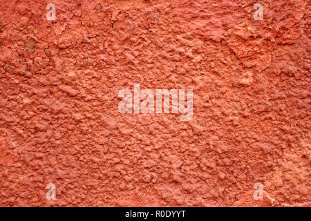 Detail of old red wall with shelled stucco Stock Photo
