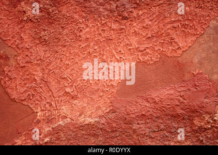 Detail of old red wall with shelled stucco Stock Photo