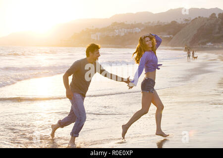 Carefree Mid-Adult Couple at Beach Stock Photo