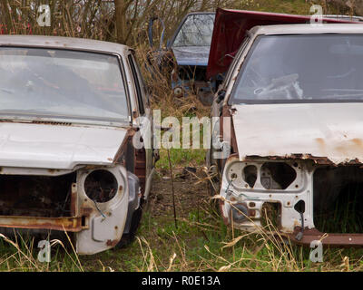 A car graveyard with old and rusted carwrecks Stock Photo