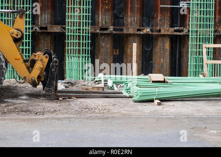 Workers are installing green welded wire steel mesh reinforcement for concrete construction Stock Photo