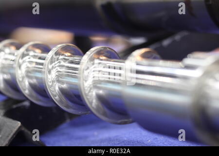 Screw press parts for plastic injection machine ; selective focus Stock Photo