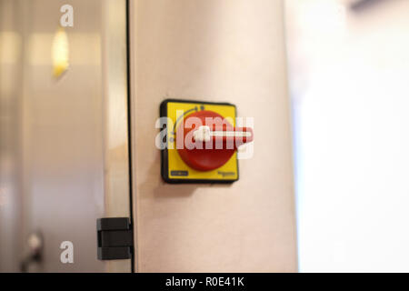 Emergency ON/OFF industrial switch of a food industry equipment. Emergency stop Stock Photo