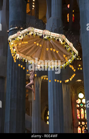 Jesus on the cross hanging from the ceiling in the Sagrada Familia, Barcelona, Spain Stock Photo